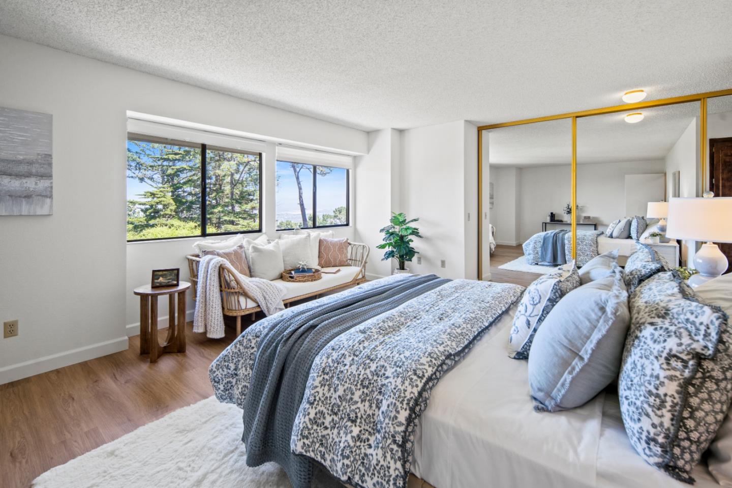 70 Forest Ridge Road, Unit 22 Monterey, CA 93940 - Photo 8 of 17 a spacious bedroom with a bed and wooden floor