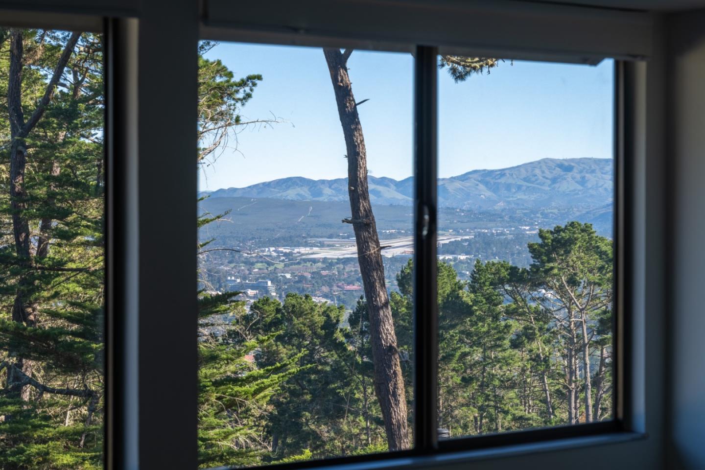 70 Forest Ridge Road, Unit 22 Monterey, CA 93940 - Photo 10 of 17 a view of a window in front of a tree