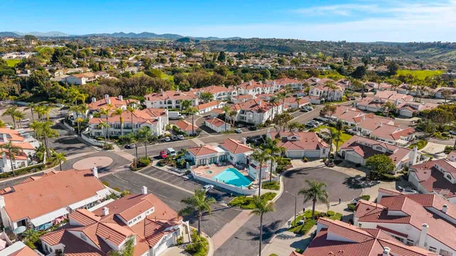 a view of a swimming pool with chairs