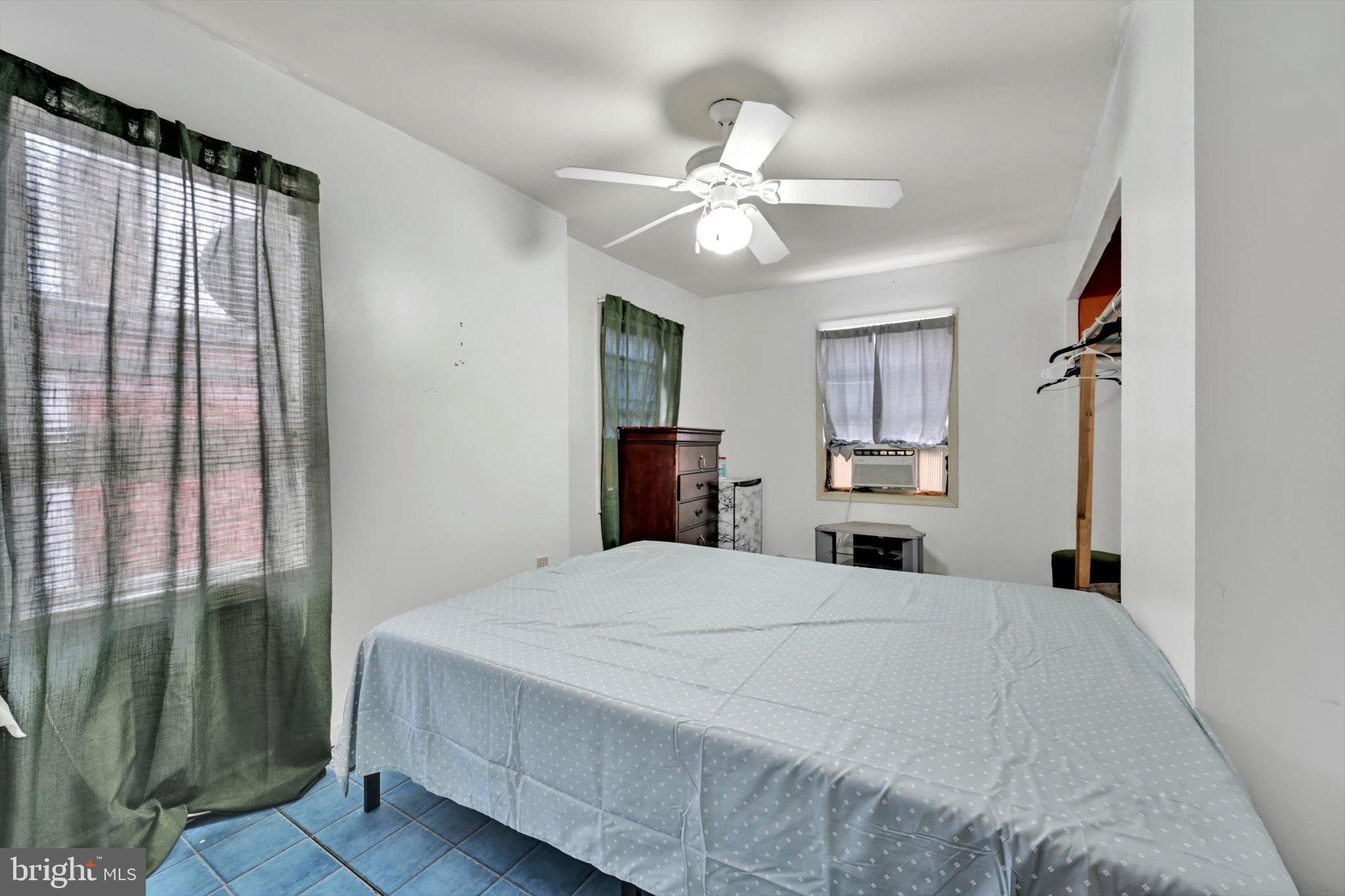 352 South Ann Street Lancaster, PA 17602 - Photo 12 of 23 a bedroom with a large bed and a chandelier