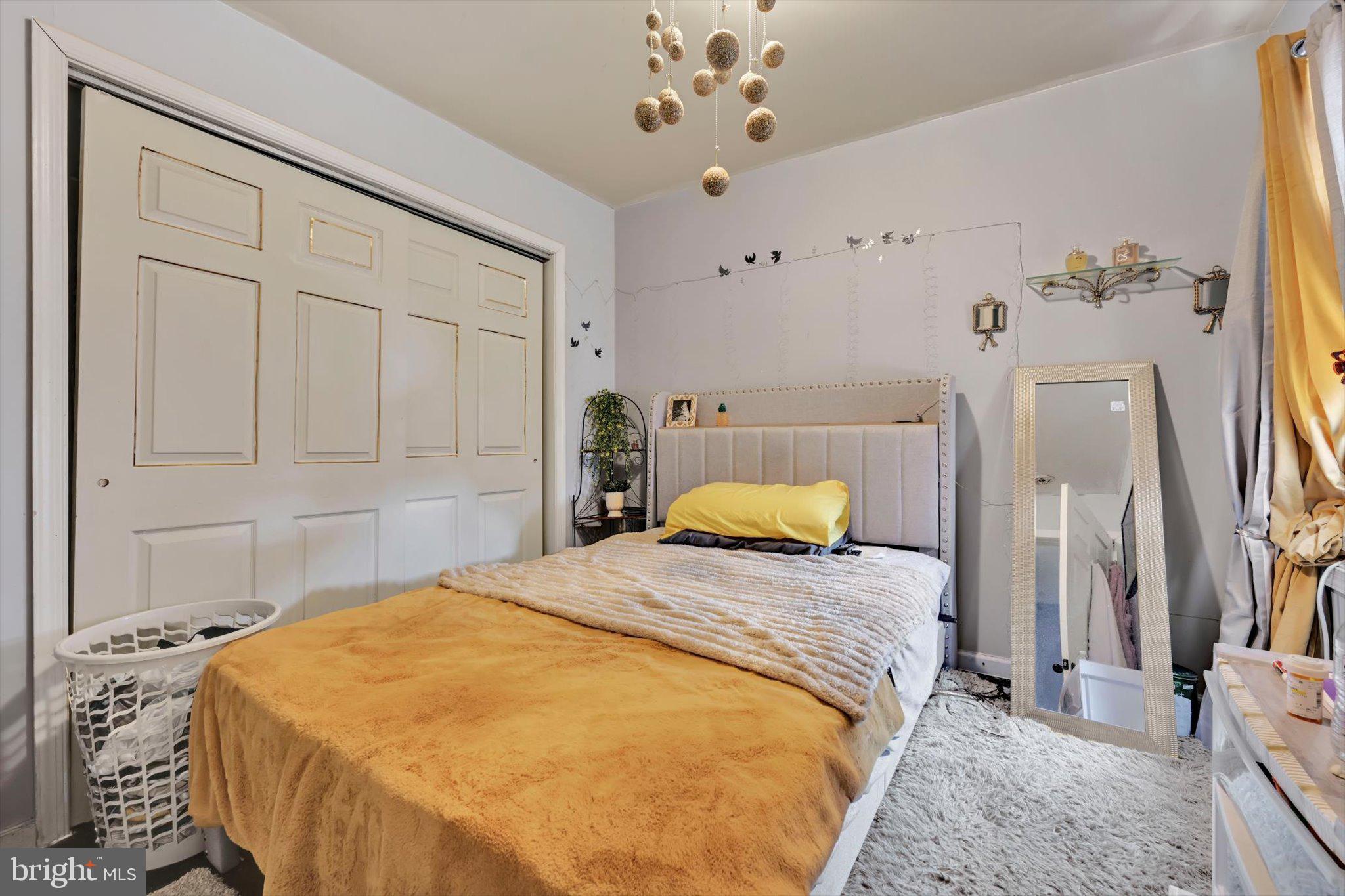 352 South Ann Street Lancaster, PA 17602 - Photo 15 of 23 a bedroom with a bed and a chandelier