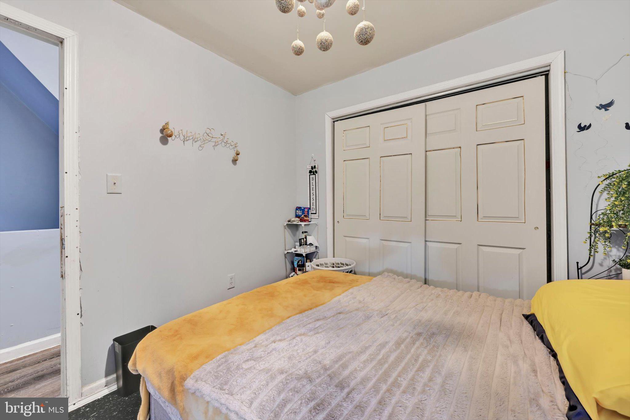 352 South Ann Street Lancaster, PA 17602 - Photo 16 of 23 a bedroom with a large bed and a chandelier