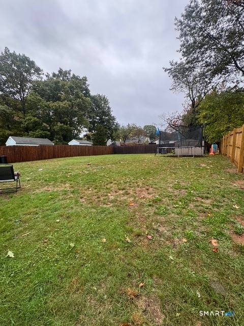 33 Westview Street Hamden, CT 06514 - Photo 11 of 11 a large yard with lots of green space and fog