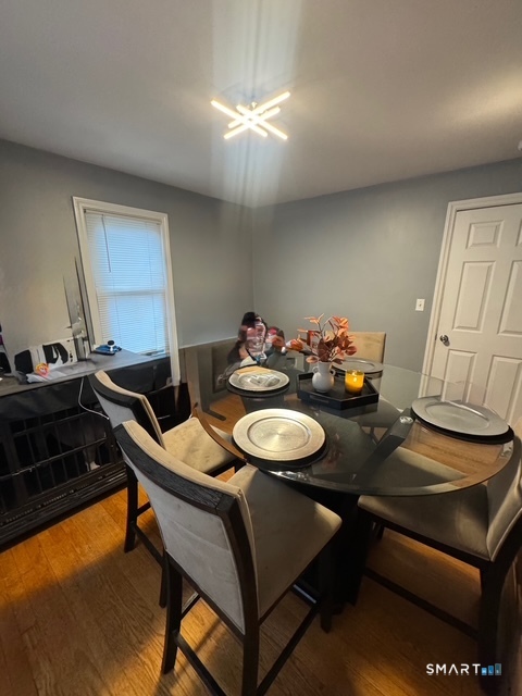 33 Westview Street Hamden, CT 06514 - Photo 3 of 11 a dining room with furniture and wooden floor