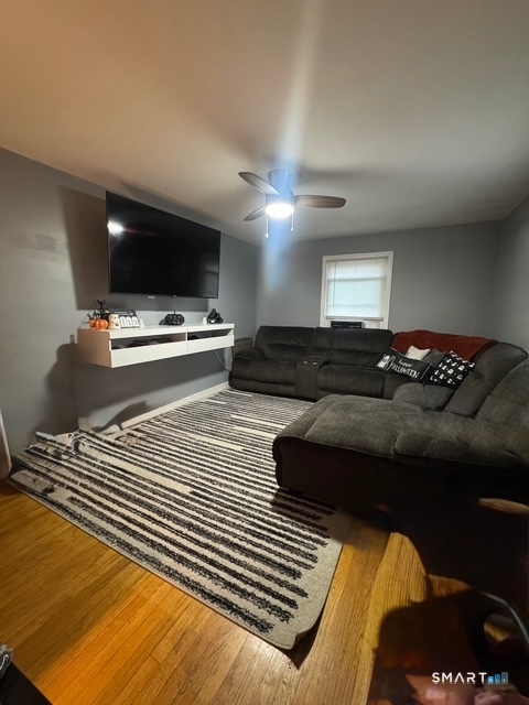 33 Westview Street Hamden, CT 06514 - Photo 5 of 11 a living room with furniture a flat screen tv and a fireplace