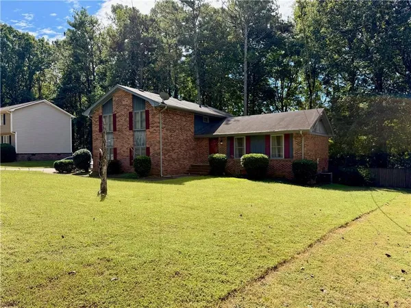 a front view of a house with yard