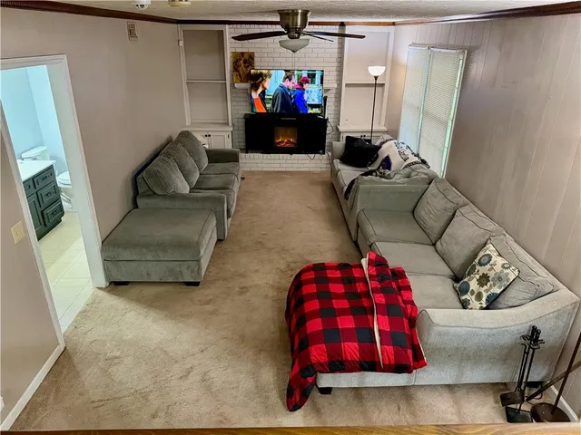 a bathroom with a sink vanity mirror and toilet