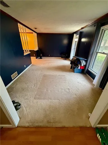 a bedroom with bed and window