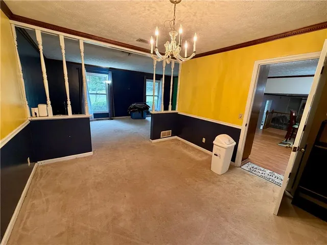 a view of a hallway with wooden shelves