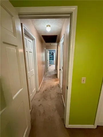 a bedroom with a bed dresser and a window