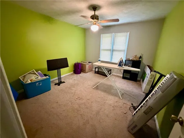 a room with gym equipment and a mirror