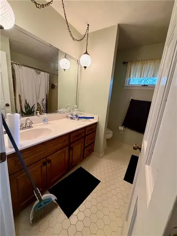 a bedroom with bed and window