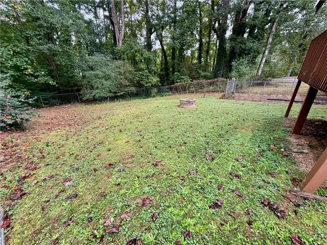 a view of backyard with green space