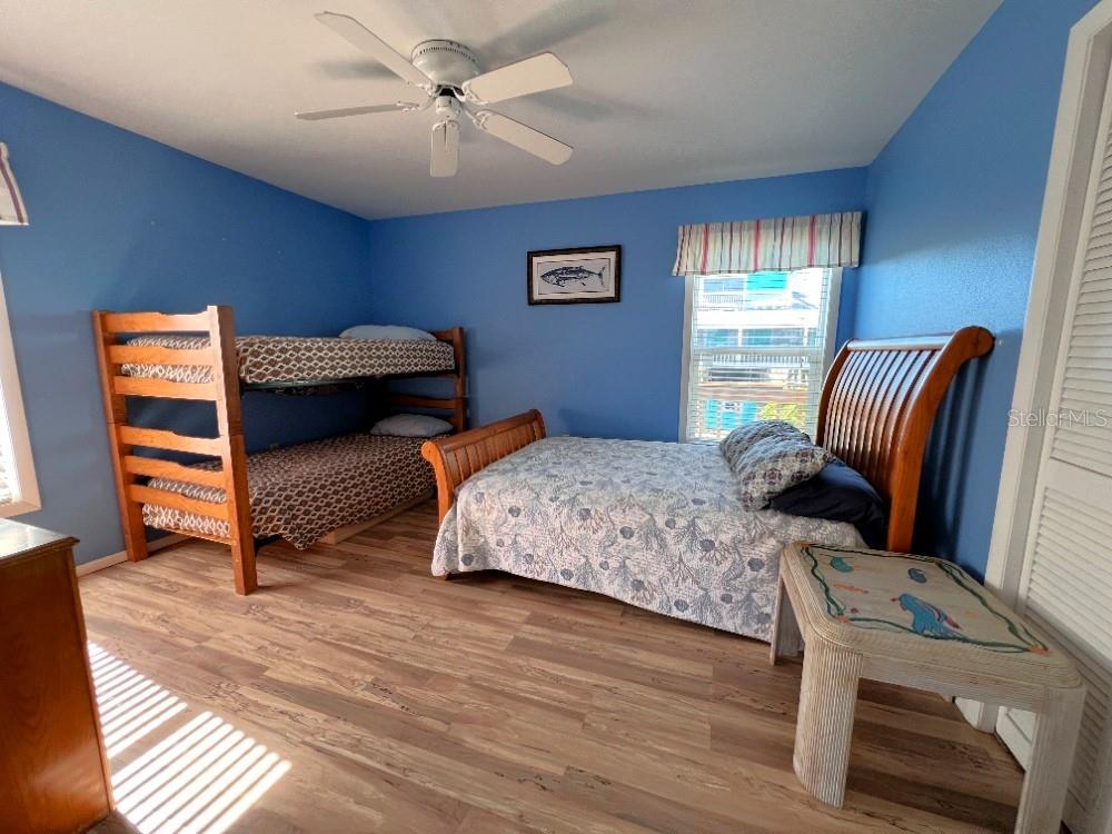 9526 Jolly Roger Trail Placida, FL 33946 - Photo 18 of 54 a bedroom with two beds and a window