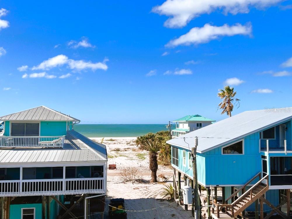 9526 Jolly Roger Trail Placida, FL 33946 - Photo 22 of 54 a front view of a house with a yard