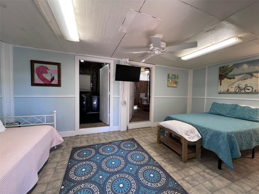 9526 Jolly Roger Trail Placida, FL 33946 - Photo 30 of 54 a spacious bedroom with a bed and a couch