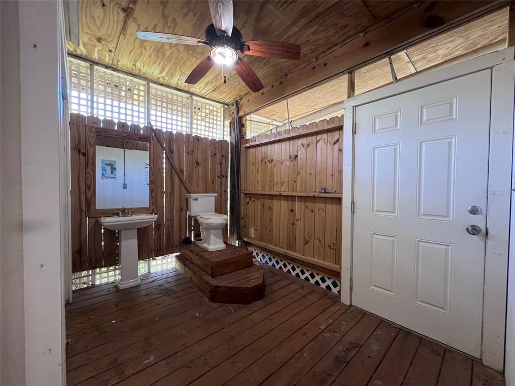 9526 Jolly Roger Trail Placida, FL 33946 - Photo 32 of 54 a view of a hallway with wooden floor and staircase
