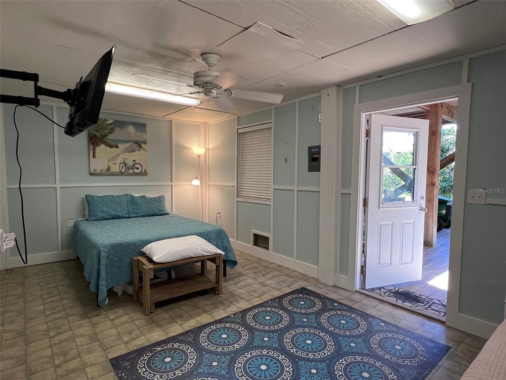 9526 Jolly Roger Trail Placida, FL 33946 - Photo 34 of 54 a bedroom with furniture and a rug