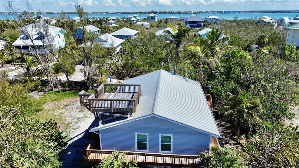 9526 Jolly Roger Trail Placida, FL 33946 - Photo 37 of 54 a view of a house with a yard