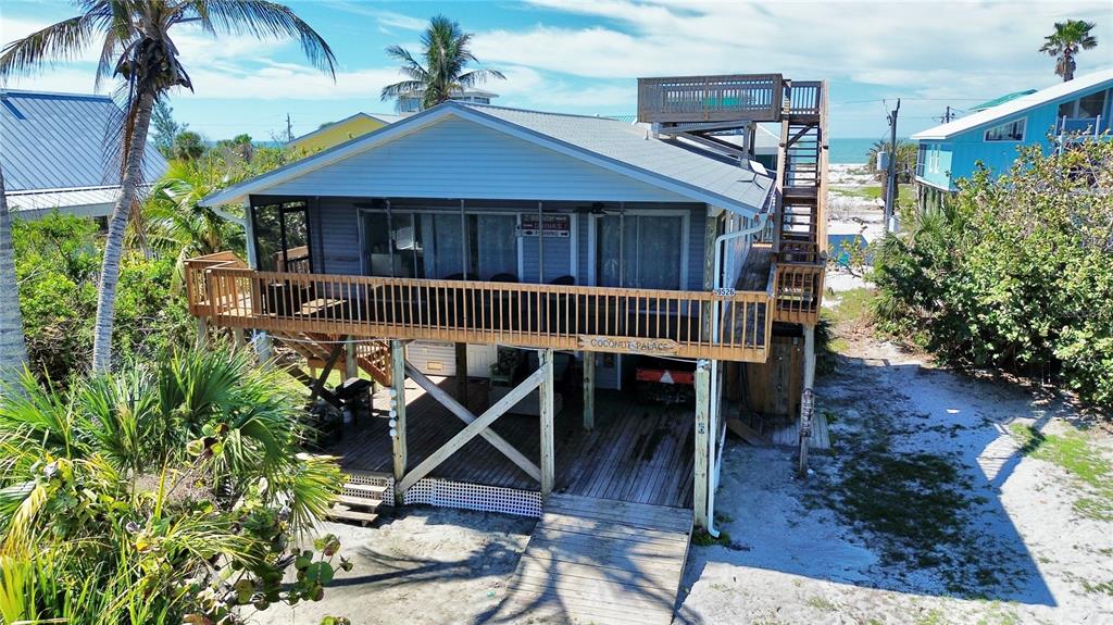 9526 Jolly Roger Trail Placida, FL 33946 - Photo 53 of 54 a front view of a house with garden