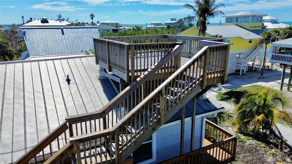 9526 Jolly Roger Trail Placida, FL 33946 - Photo 6 of 54 a view of balcony with wooden floor and fence