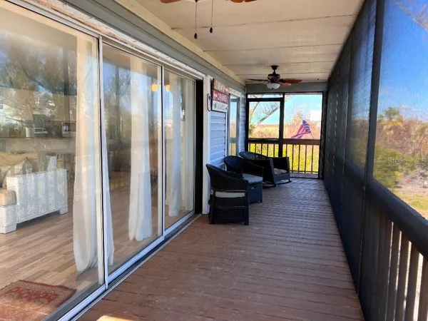 a view of a livingroom with furniture window and wooden floor