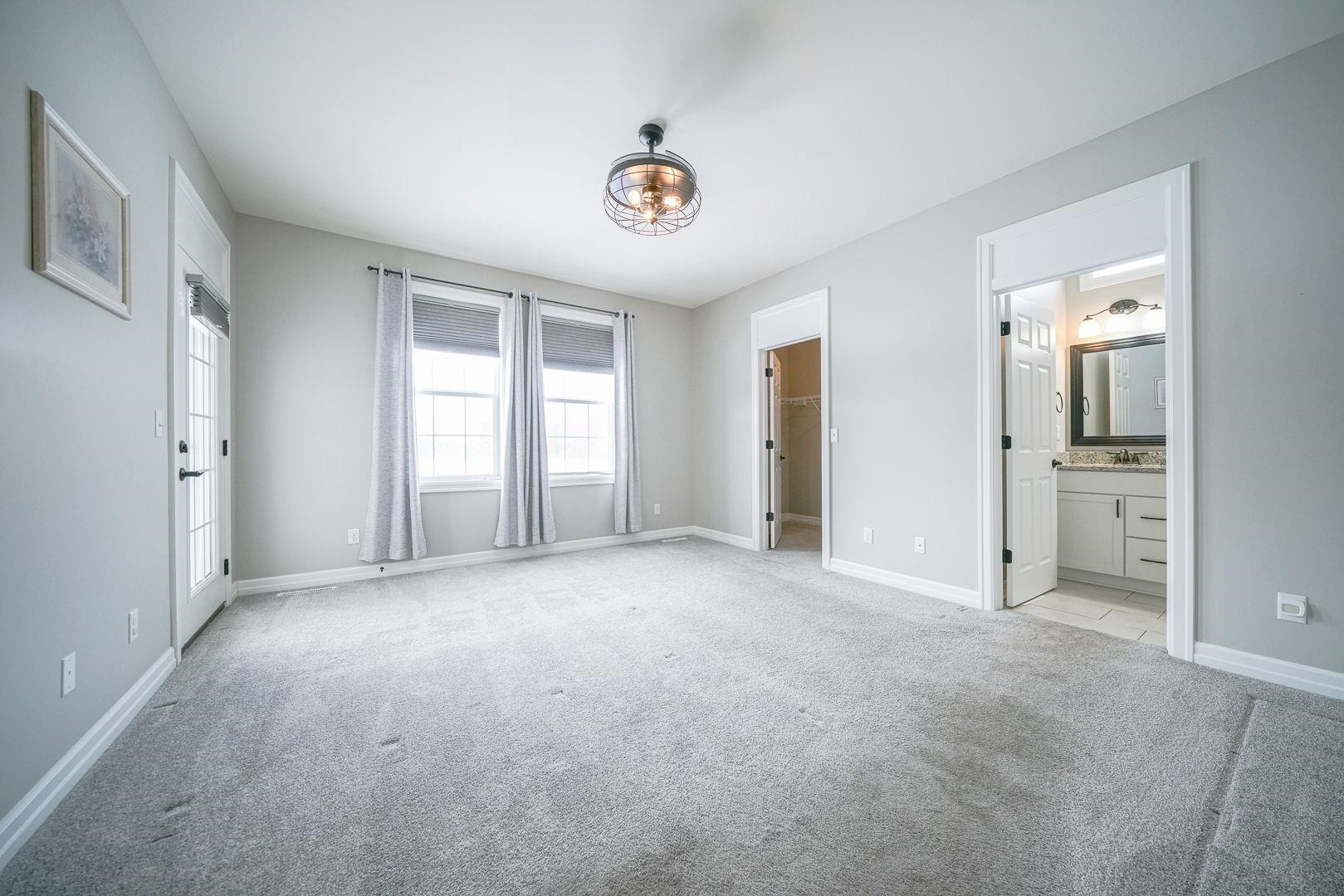 212 Martin Avenue Oregon, IL 61061 - Photo 17 of 29 an empty room with windows and cabinet