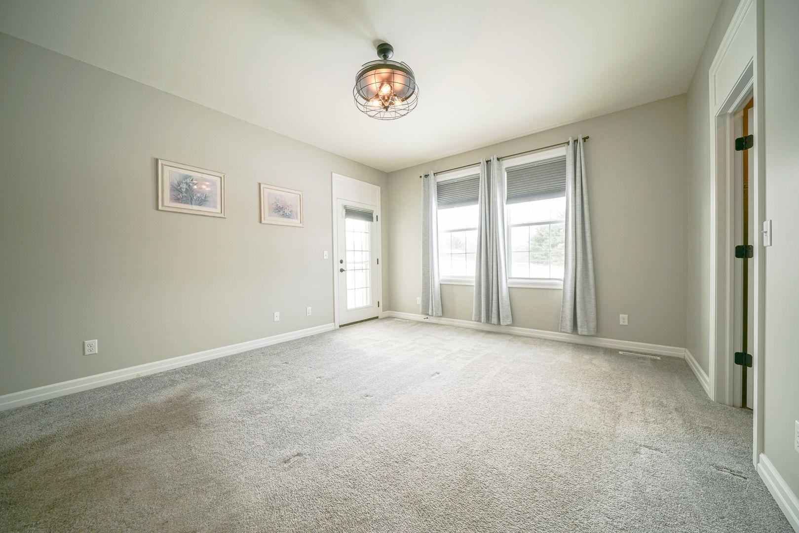 212 Martin Avenue Oregon, IL 61061 - Photo 20 of 29 an empty room with windows and closet