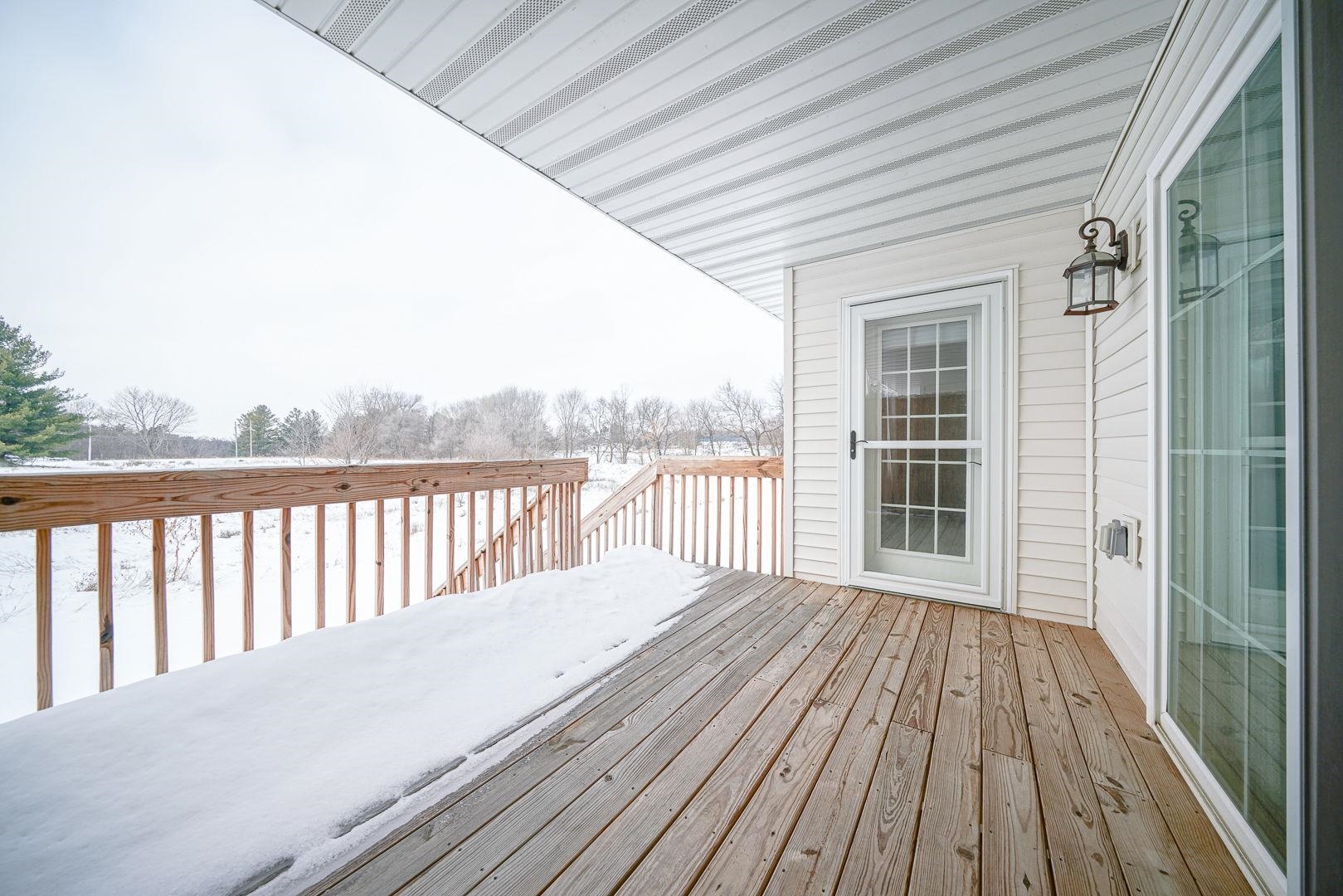 212 Martin Avenue Oregon, IL 61061 - Photo 22 of 29 a balcony with wooden floor
