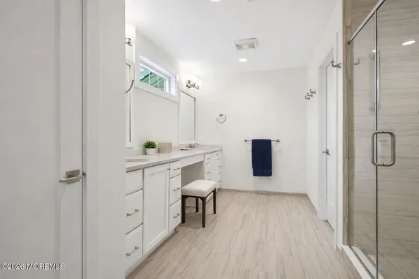 a room with a sink and a mirror