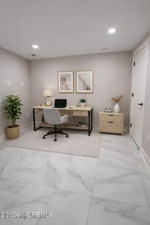 a living room with furniture and flowers