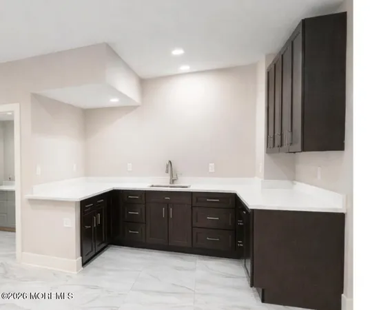 a kitchen with a sink and cabinets