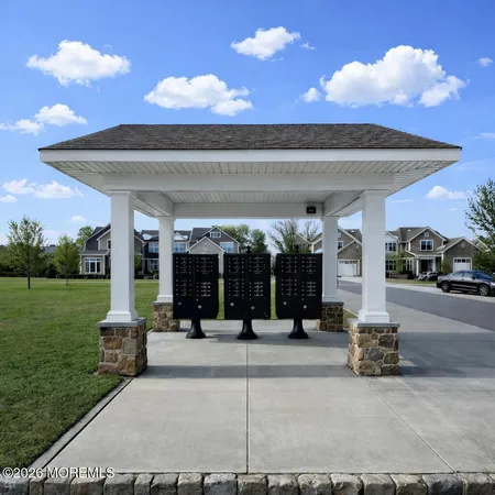 a view of a house with sitting area and garden