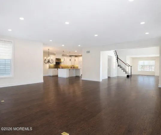 a view of a living room with kitchen