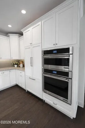 a kitchen with appliances and cabinets
