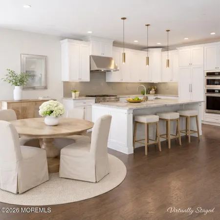 a kitchen with a table and chairs in it