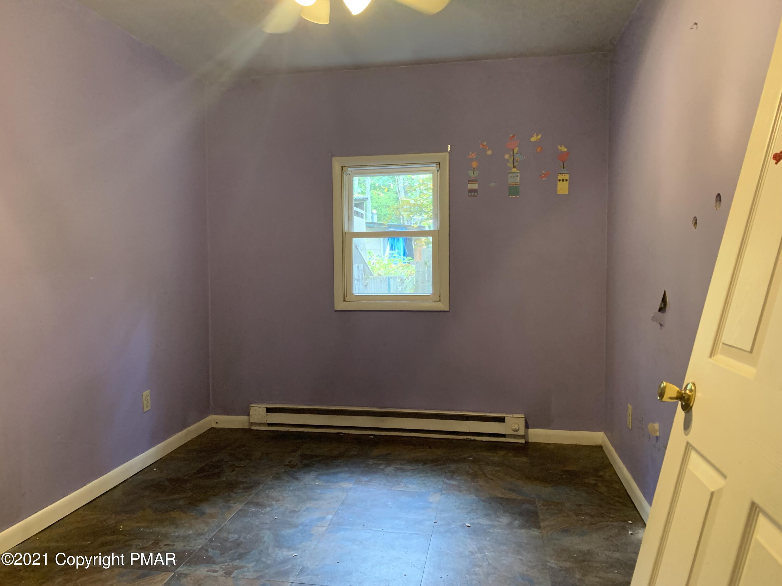203 Semmel Road Effort, PA 18330 - Photo 11 of 18 a view of a room with rack on the wall and a window