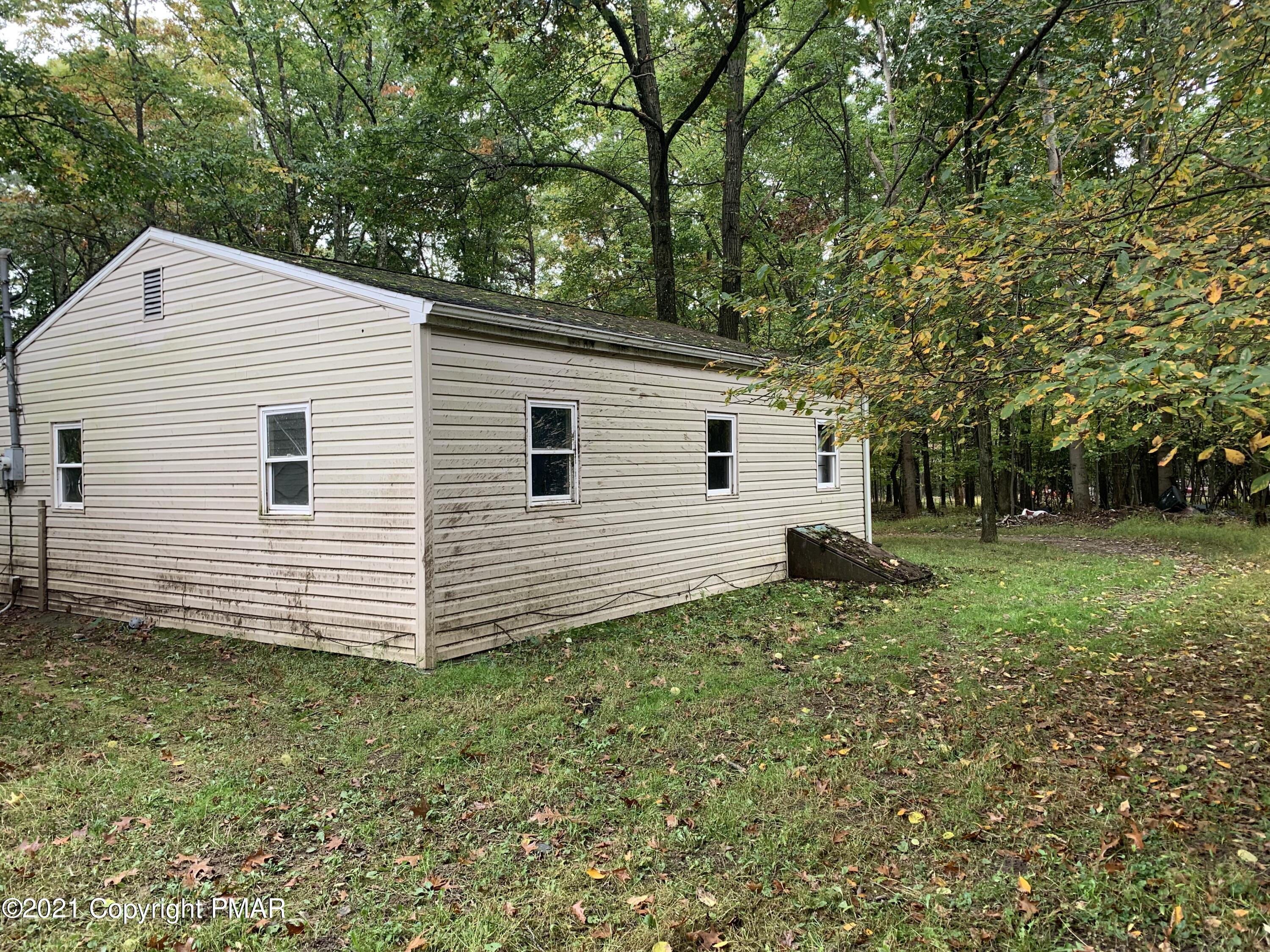 203 Semmel Road Effort, PA 18330 - Photo 4 of 18 a view of a house with a yard