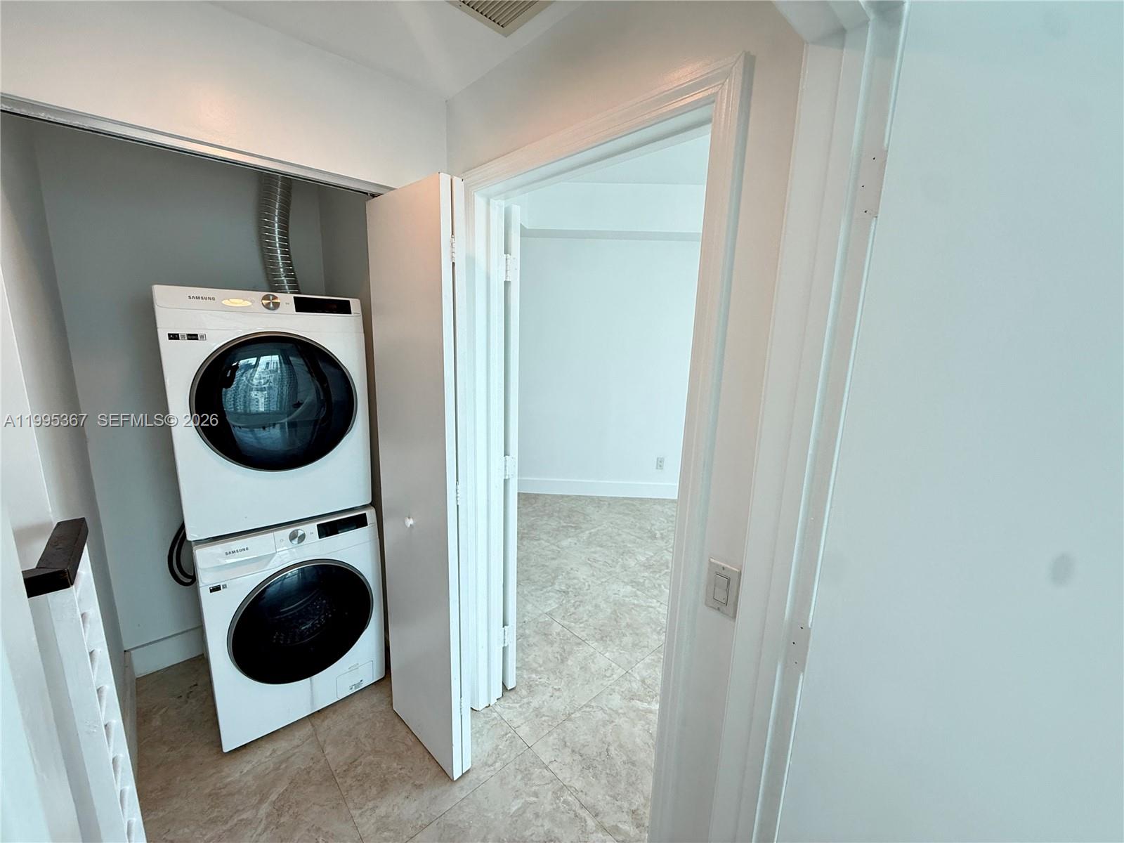 60 Southwest 13th Street, Unit 4018 Miami, FL 33130 - Photo 11 of 26 a utility room with dryer and washer