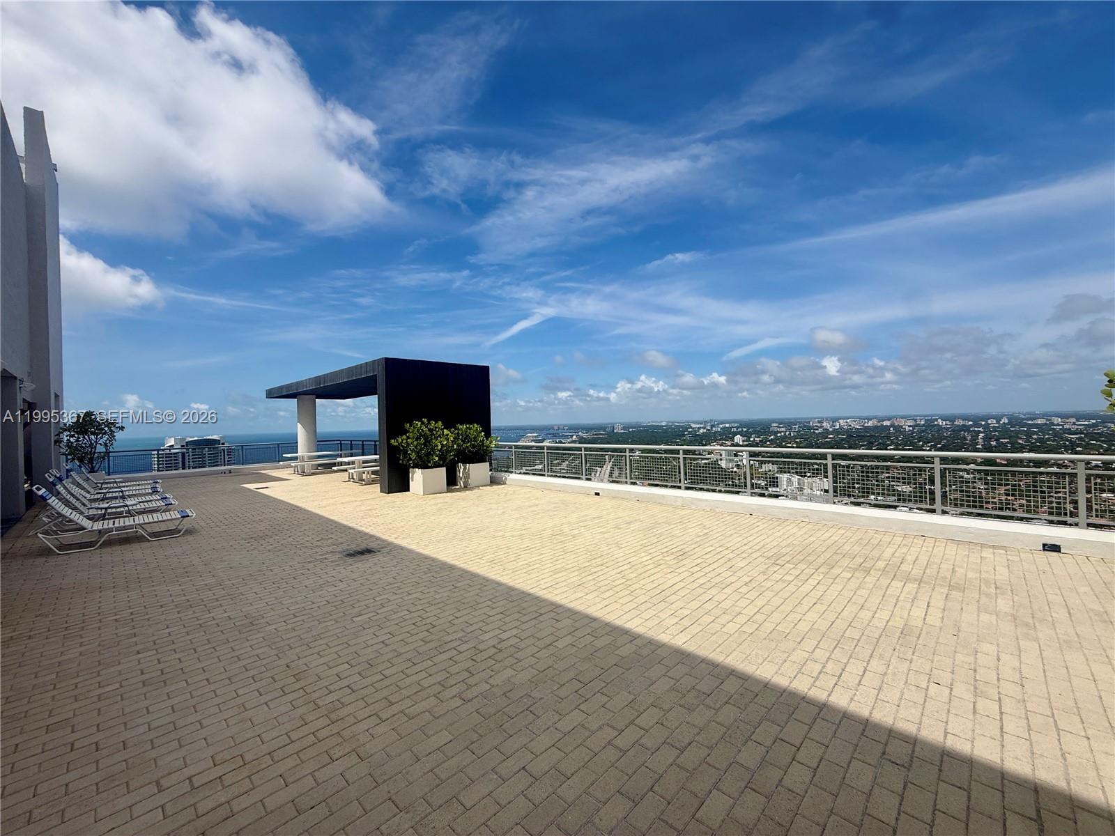 60 Southwest 13th Street, Unit 4018 Miami, FL 33130 - Photo 23 of 26 a view of a terrace with sky view