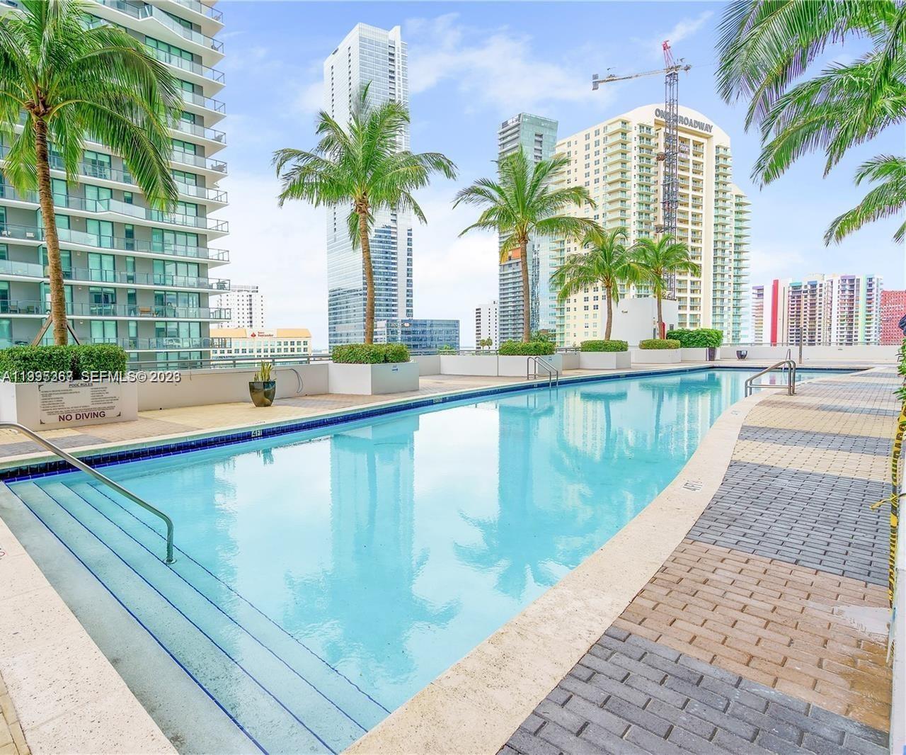60 Southwest 13th Street, Unit 4018 Miami, FL 33130 - Photo 26 of 26 a view of swimming pool with outdoor seating