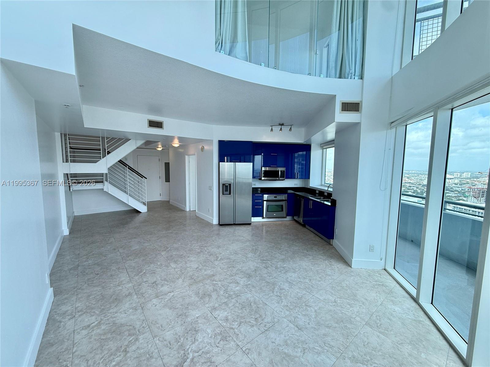 60 Southwest 13th Street, Unit 4018 Miami, FL 33130 - Photo 5 of 26 a view of kitchen and refrigerator