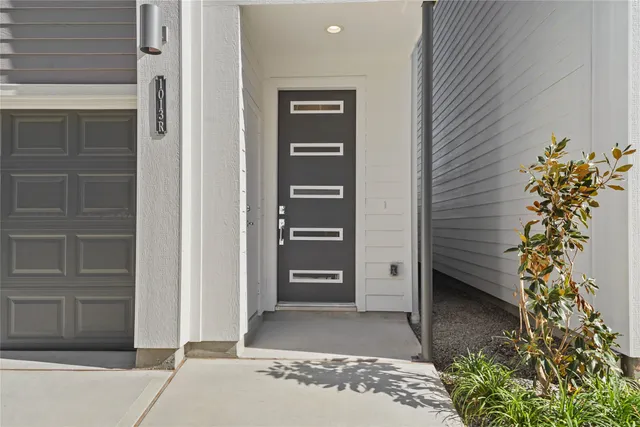 a front view of a house with a street