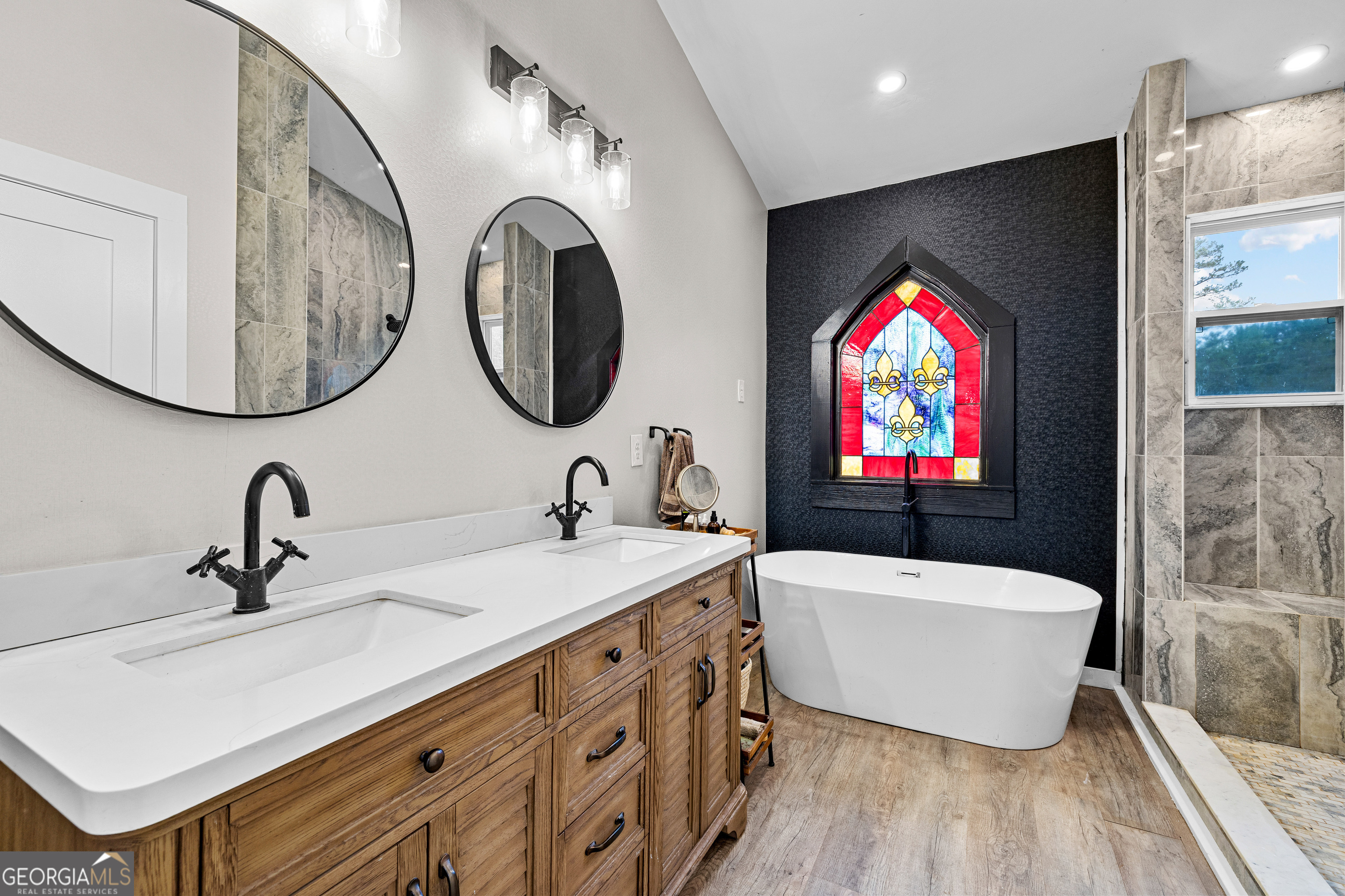 1329 Standing Rock Road Senoia, GA 30276 - Photo 17 of 77 a bathroom with a sink and a mirror