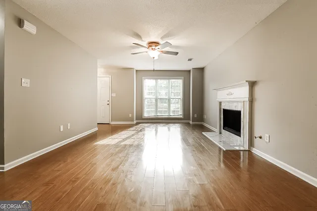 wooden floor in an empty room with a window