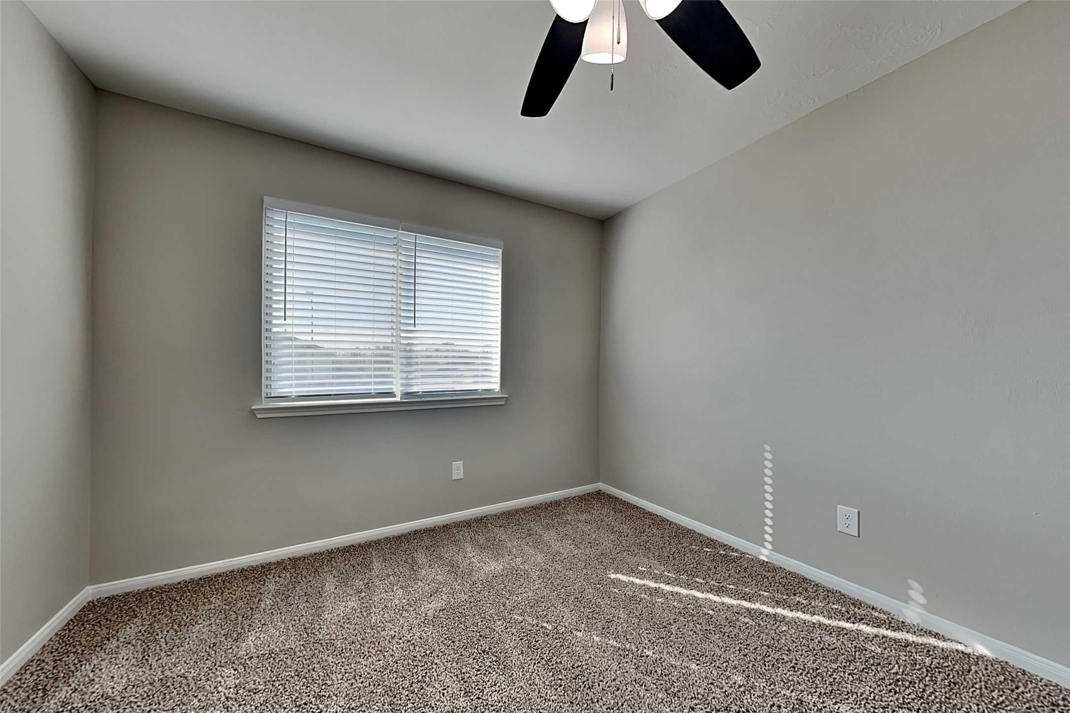 29207 Fox Fountain Lane Spring, TX 77386 - Photo 18 of 24 an empty room with a ceiling fan and window