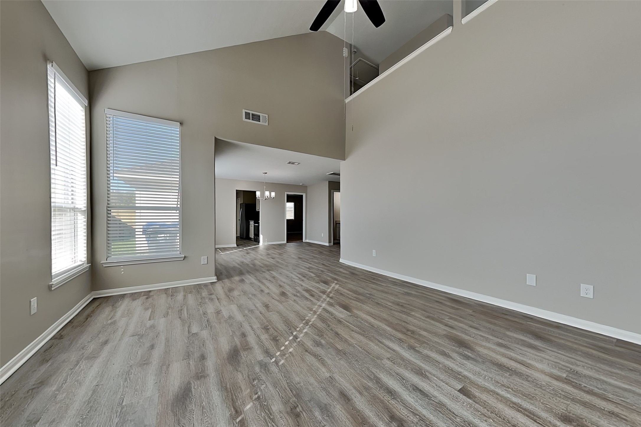 29207 Fox Fountain Lane Spring, TX 77386 - Photo 2 of 24 wooden floor in an empty room with a window