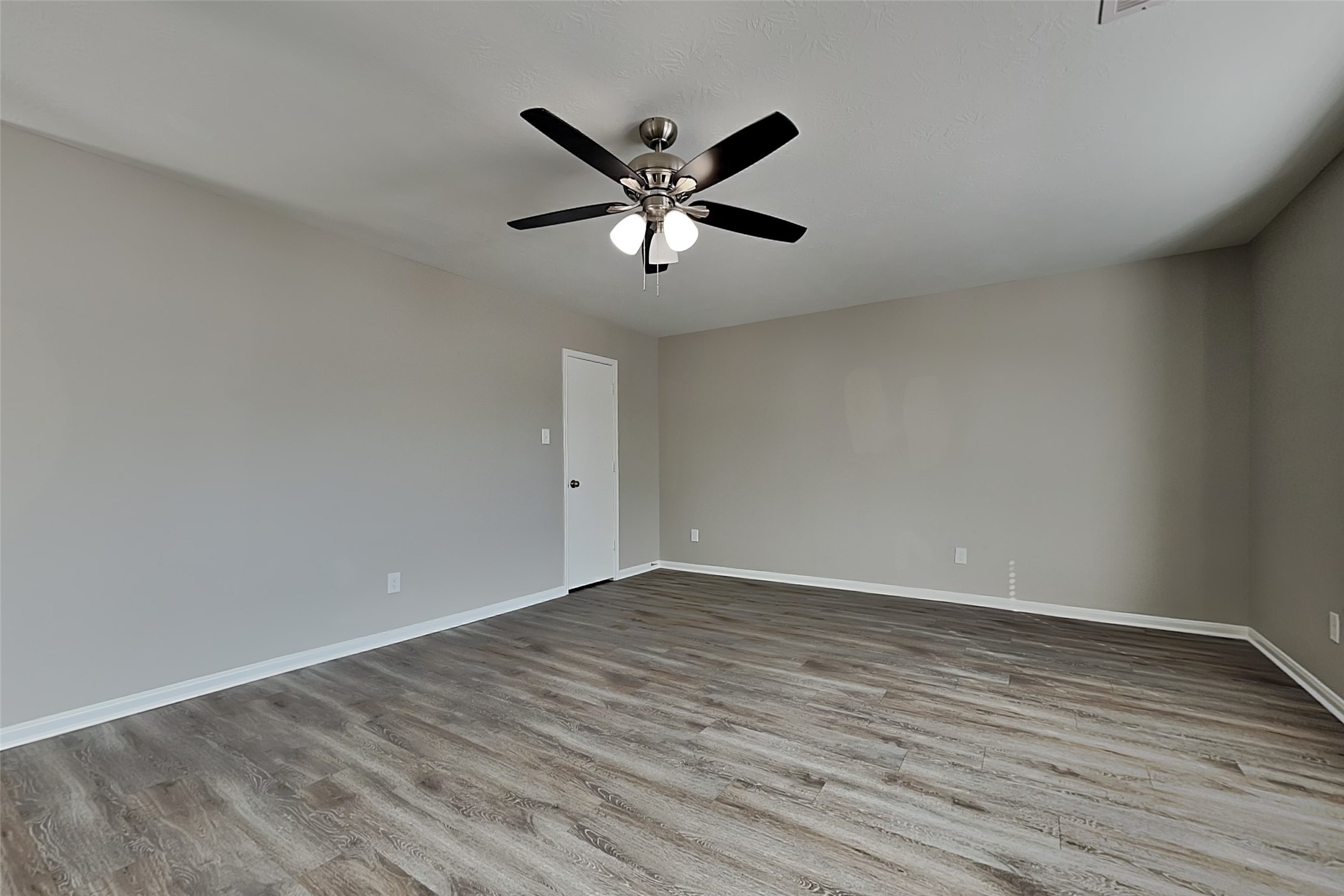 29207 Fox Fountain Lane Spring, TX 77386 - Photo 4 of 24 a view of an empty room with wooden floor