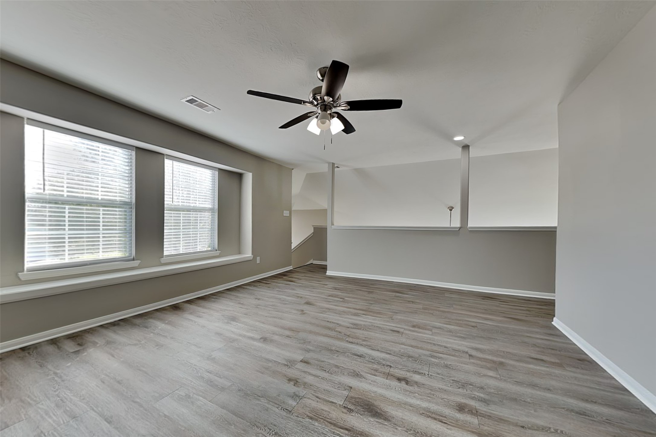 29207 Fox Fountain Lane Spring, TX 77386 - Photo 5 of 24 wooden floor in an empty room with a window