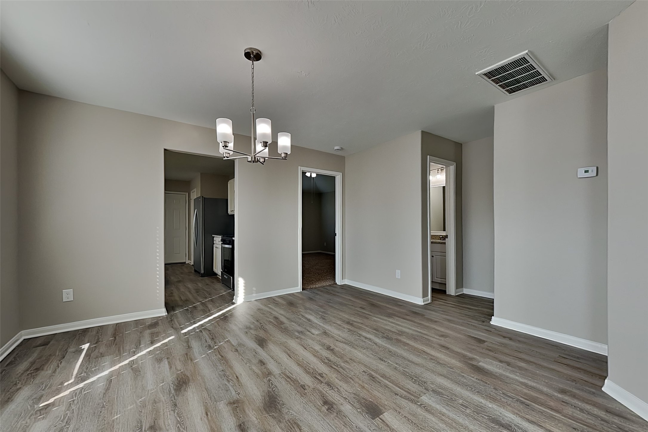 29207 Fox Fountain Lane Spring, TX 77386 - Photo 10 of 24 wooden floor in an empty room with a window